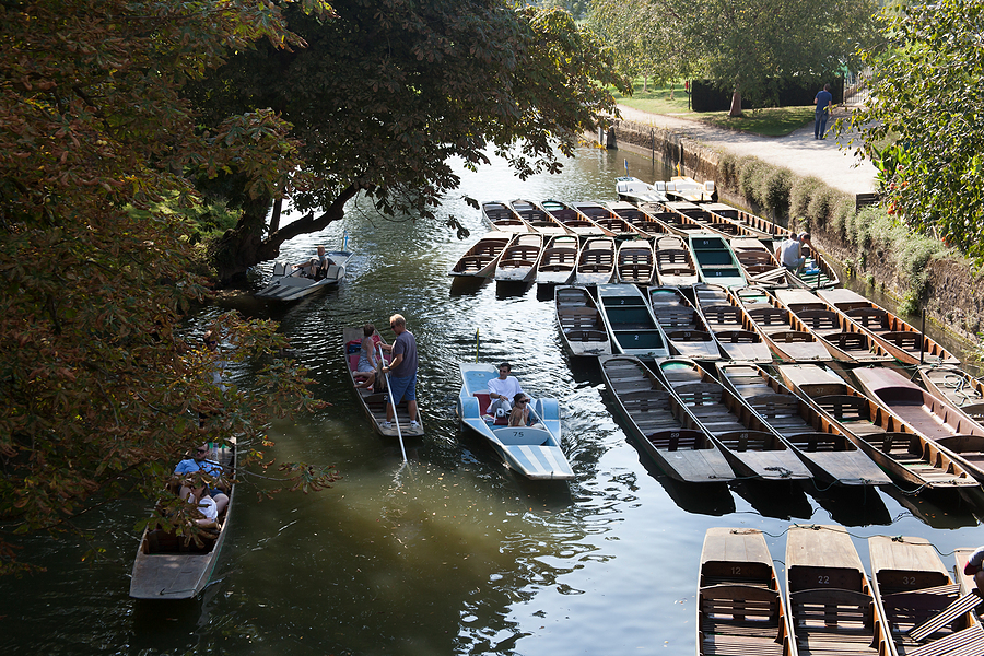 People punting on the Cherwell Channel in Oxford by Magdalen Bridge.