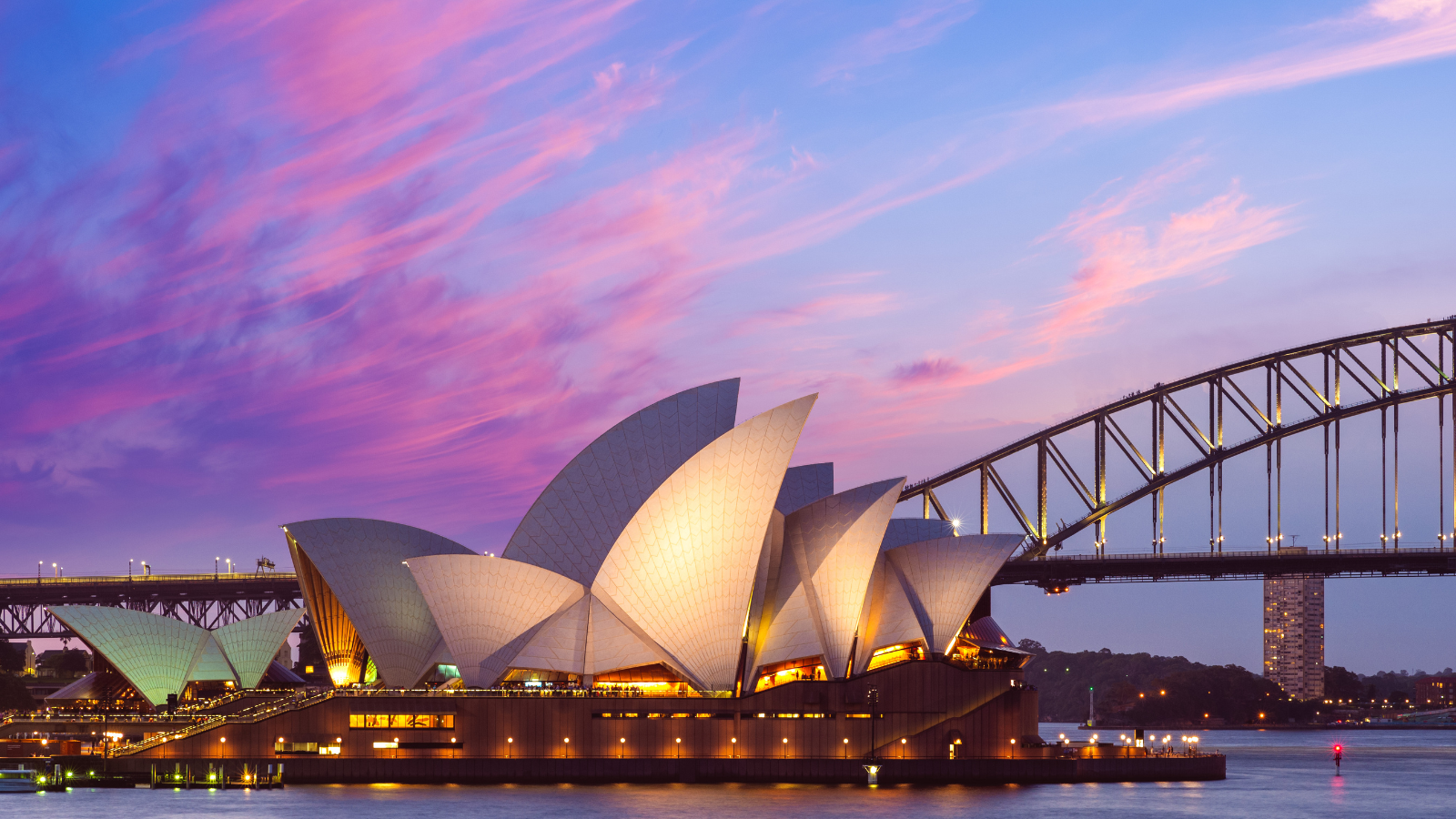 Sydney Opera House with a pink sky in the background.