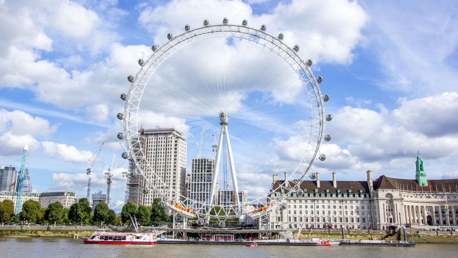 Wide-angle view of the London Eye and River Thames in London, England