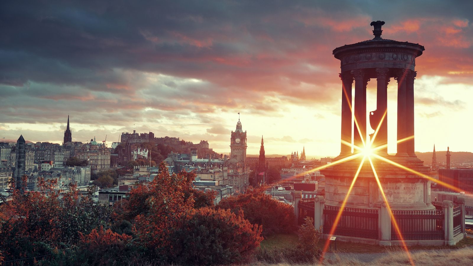 Edinburgh skyline viewed from Calton Hill during sunset.